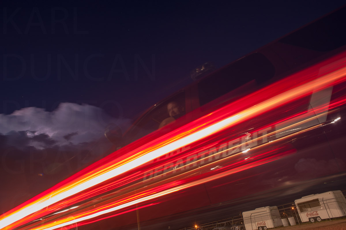 Firefighter with storm in background image by Karl Duncan Photography