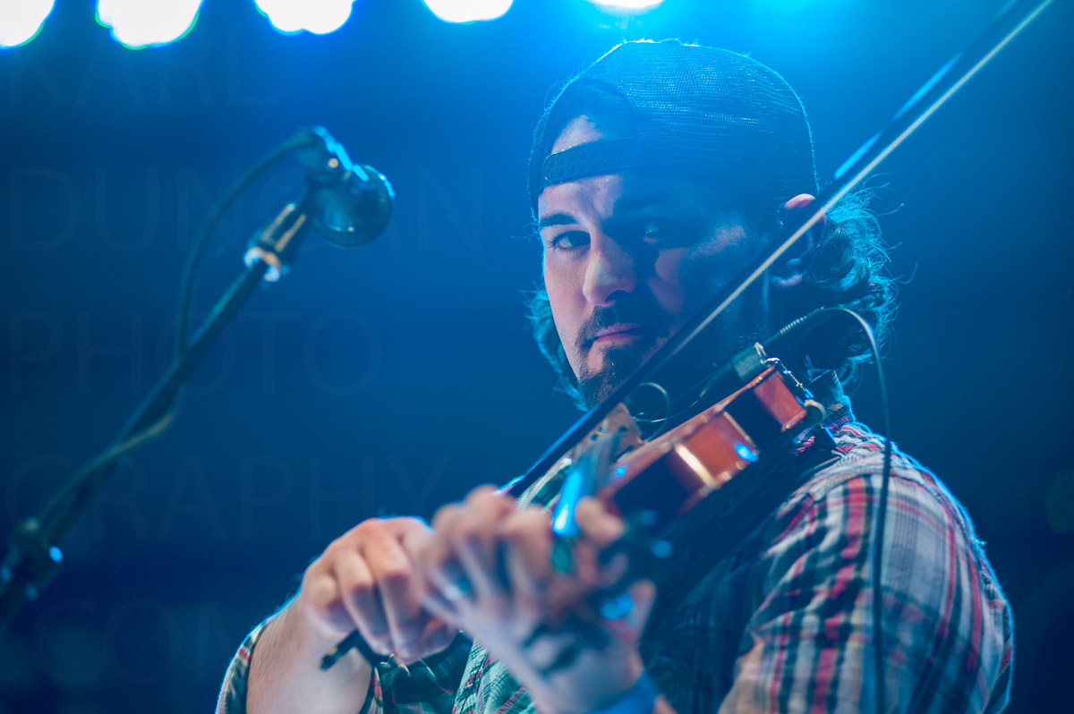 Violin fiddler live in lights image by Karl Duncan Photography