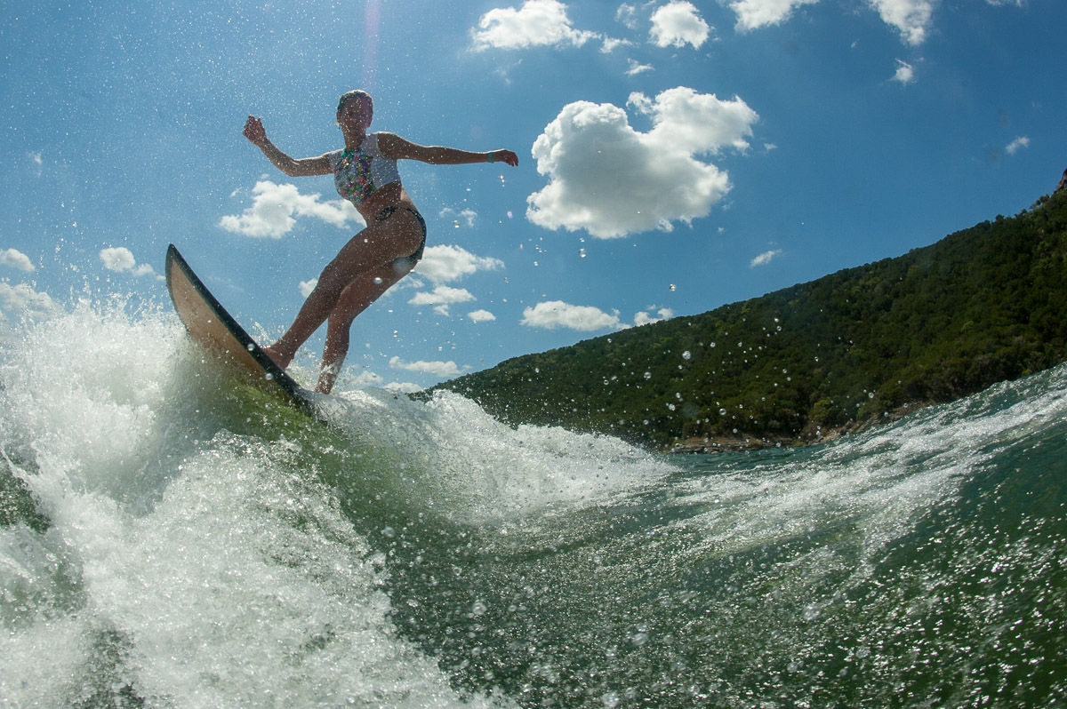 Action wake surfer girl on lake image by Karl Duncan Photography